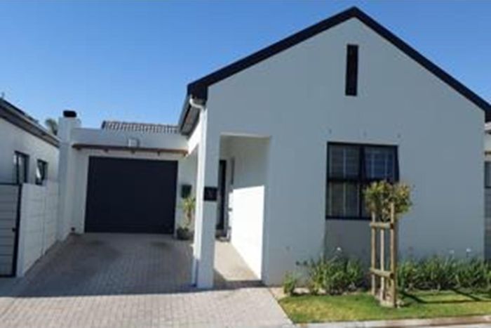 For Sale: Townhouse in Brackenfell South with garden, garage, and playground access.