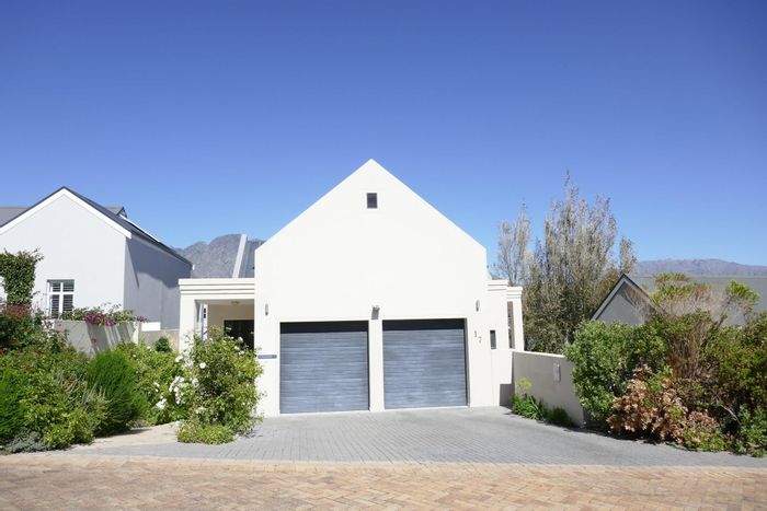 For Sale: House in Franschhoek Central with pool, wine room, and mountain views.