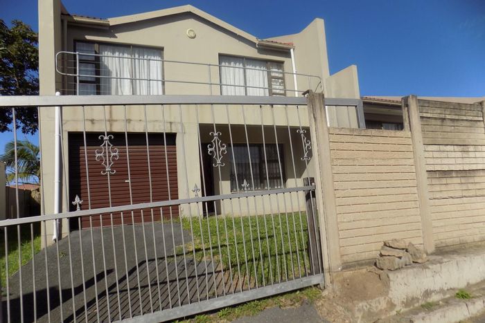 Secure Greenfields Townhouse For Sale: Spacious rooms, garden with braai area, garage.