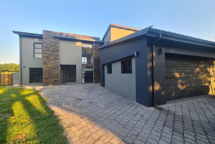 For Sale: House in Mzingazi Golf Estate with pool, garage, and scenic views.