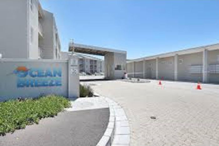 For Sale: Apartment in Muizenberg Central with pool, security, and laundry facilities.