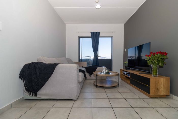 For Sale: Apartment in Parklands North with secure community, balcony, and parking.