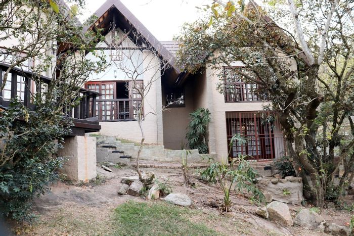 Nelspruit Ext 5 House For Sale: Versatile units, business zoning, secure parking.