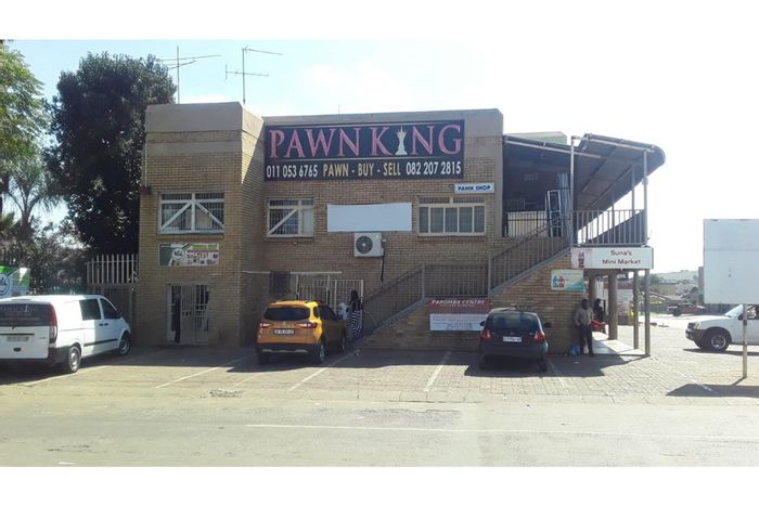 Retail property for sale in Lenasia Ext 1 with shops and apartments.