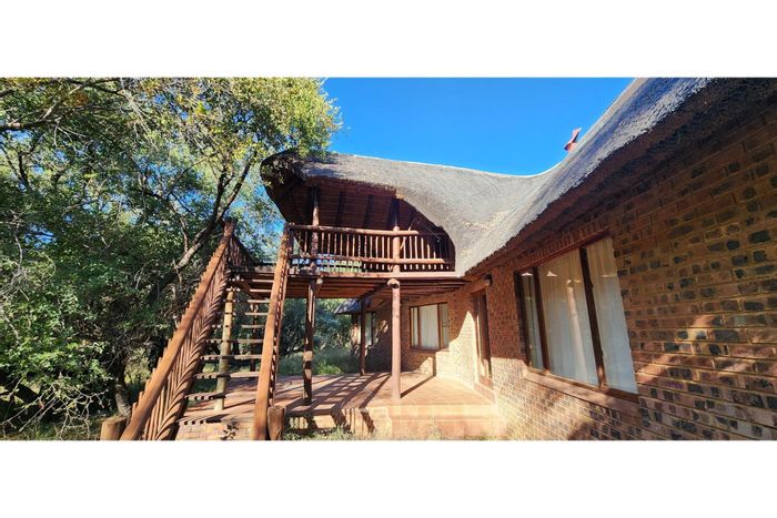 House for Sale in Mabalingwe Nature Reserve: Three bedrooms, outdoor living, and wildlife views.