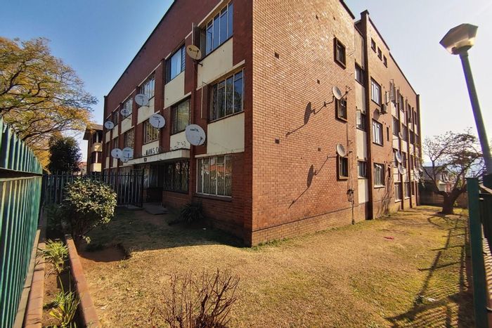 Two-bedroom apartment for sale in Pietermaritzburg Central with fitted kitchen and lounge.