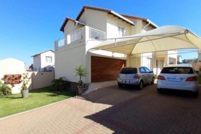 For Sale: Spacious 4-Bedroom House in Blue Hills with Automated Garage and Security.