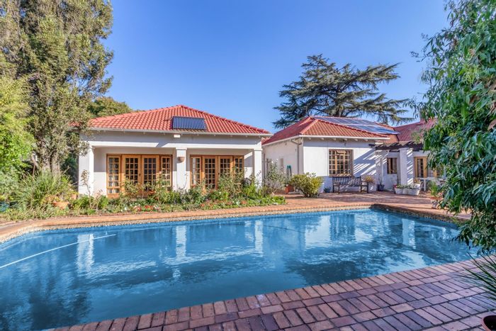 Parktown House For Sale: Spacious family home with pool, garden, and solar power.