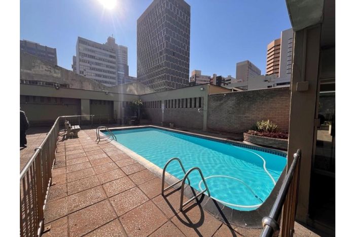 1-Bedroom Apartment For Sale in Durban Central with pool, security, and parking.