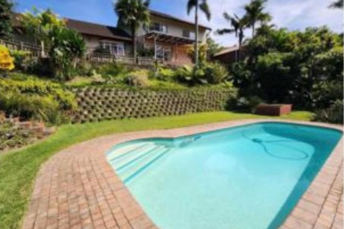 For Sale: House in Padfield Park with dual rental potential, koi pond, and pool.