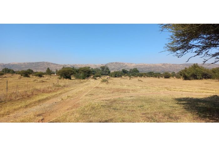 Kameeldrift West Farm For Sale: 2 plots, ample storage, borehole, and living spaces.