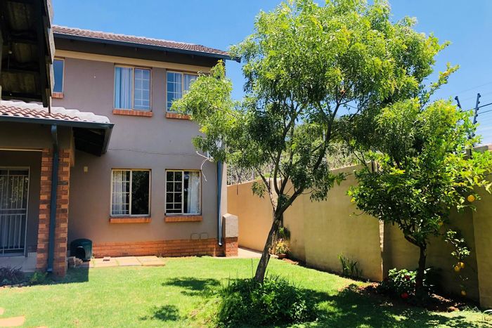 For Sale: Mooikloof Ridge Townhouse with private garden, double garage, and guest room.