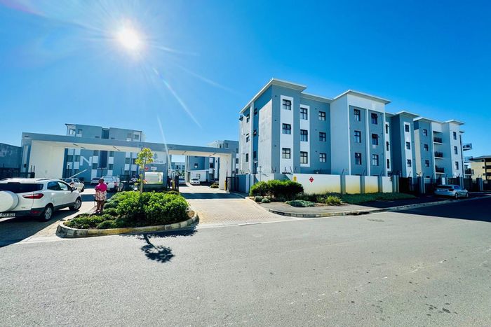 Ground-floor apartment in Parklands for sale, featuring private backyard and security estate.