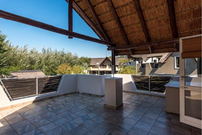 For Sale: Apartment in Fourways with pool, clubhouse, tennis court, and bushveld views.