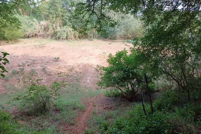 Riverfront vacant land for sale in Elephant Rock Eco Estate, ideal for outdoor living.
