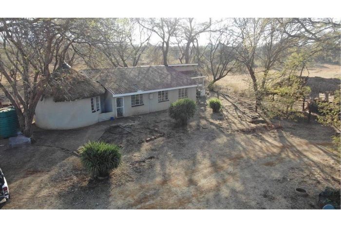 Bela Bela Rural Small Holding For Sale: Spacious land, boreholes, garages, and lapa.