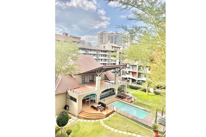 Penthouse To Rent in Sandton Central: Balcony, pool, gym, and convenient access.