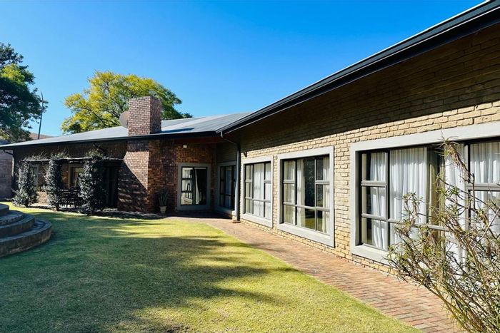 For Sale: House in Signal Hill with dual homes, garages, and landscaped gardens.