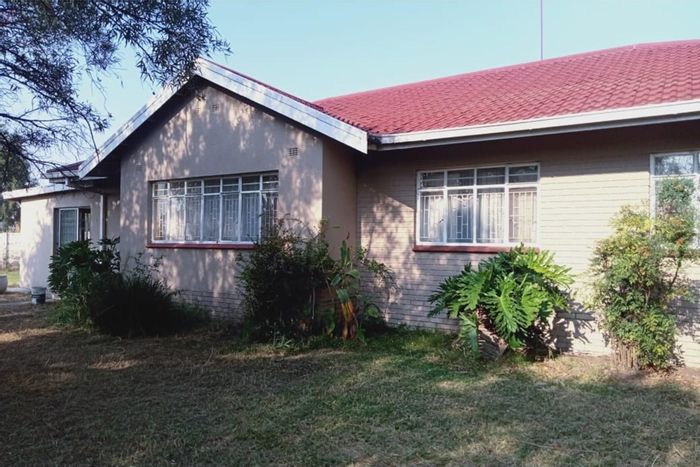 For Sale: 4-bedroom house in Ingagane with garage, carport, and security features.