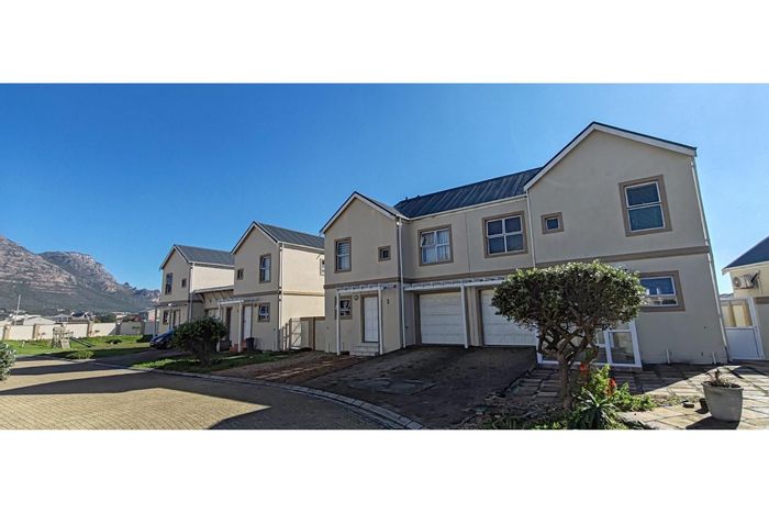 3-Bedroom Townhouse For Sale in Muizenberg Central with pool, garage, and private yard.