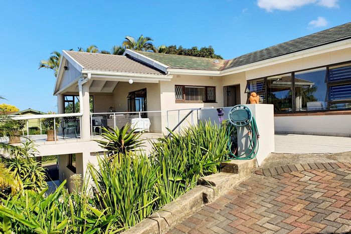 For Sale: Uvongo House with sea views, pool, gardens, and versatile living spaces.