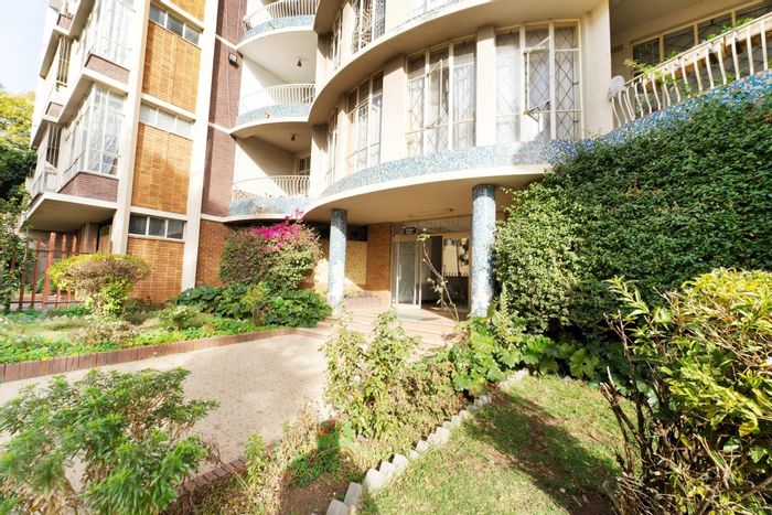 For Sale: Spacious Yeoville apartment with lift access, secure parking, and tenant in place.