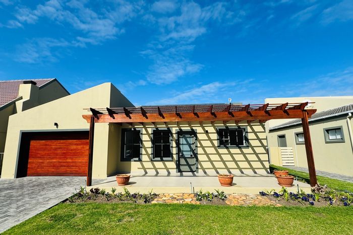 For Sale: Townhouse in Sandbaai with garden, garage, and no transfer duty.