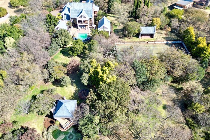 For Sale: House in Mooikloof Equestrian Estate with tennis court, pool, and stables.