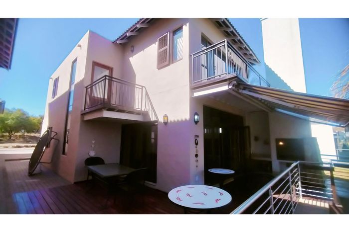 House For Sale in The Islands Estates: Canal access, pool, and office space.