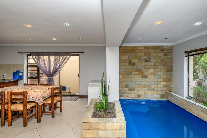 For Sale: Townhouse in Brentwood Park with pool, garage, and serene garden.