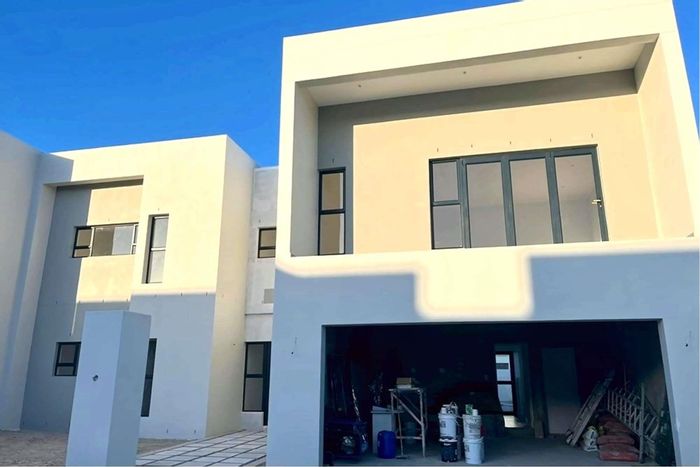 For Sale: House in Sandown, featuring 4 beds, 4 baths, and landscaped backyard.