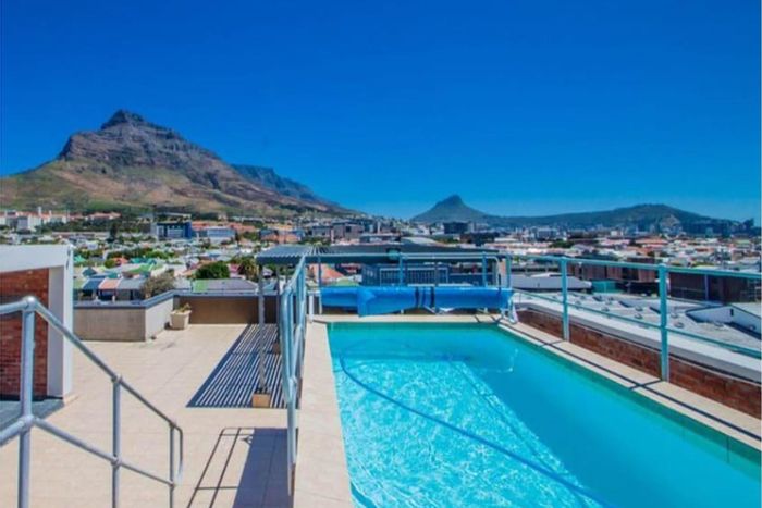 For Sale: Observatory Apartment with 24-hour security, gym, rooftop pool, and UCT proximity.