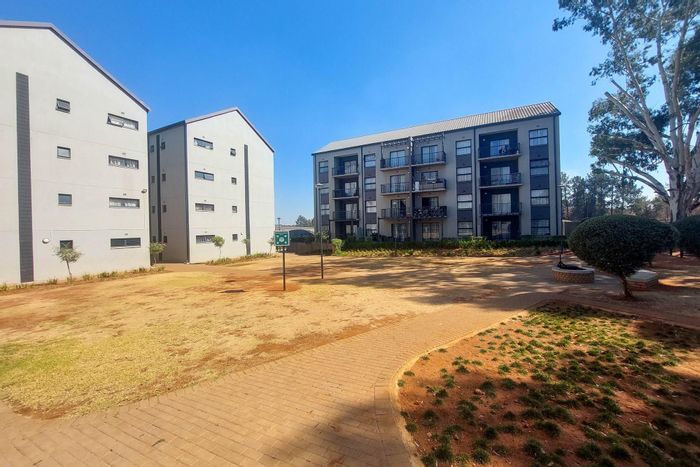 For Sale: 2-Bedroom Apartment in Clubview with balcony, play areas, and parking.