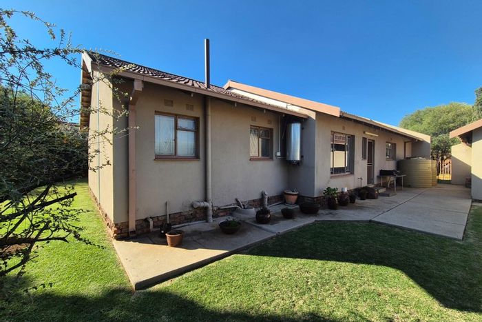 For Sale: Spacious Riebeeckstad house with 4 bedrooms, garden, and double garage.