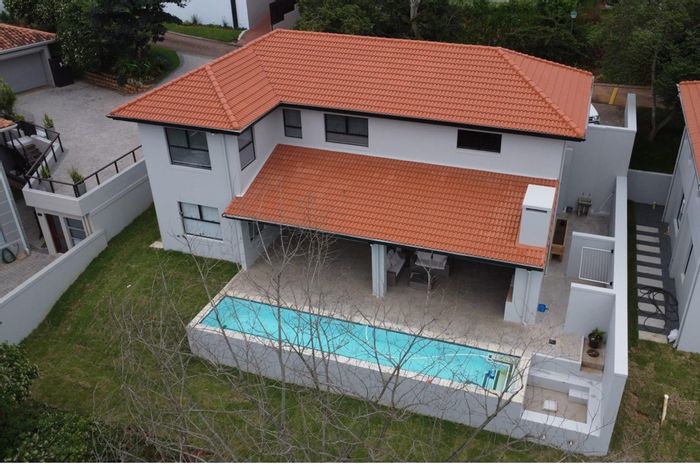 For Sale: House in Port Zimbali Estate with pool, garage, and entertainment areas.