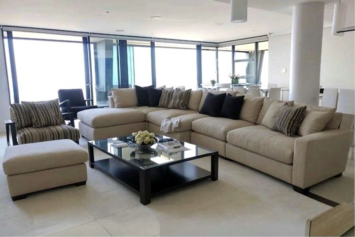 For Sale: Spacious Umhlanga Ridge apartment with pool, balcony, and three parking spaces.