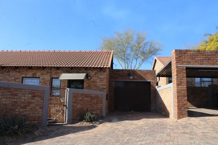 Pet-friendly townhouse for sale in Wilgeheuwel with private garden and ample parking.