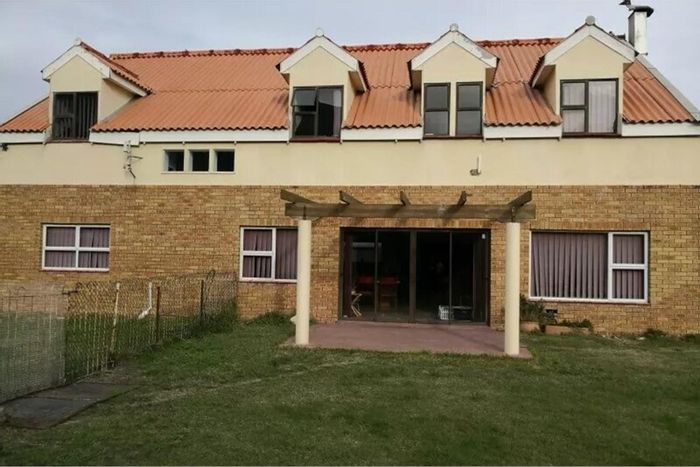 For Sale: 11-bedroom house in Bettys Bay Central with pool, gardens, and garages.