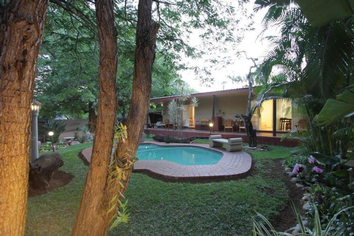 House for Sale in Hoedspruit Central: 7 bedrooms, pool, secure garden, guesthouse potential.