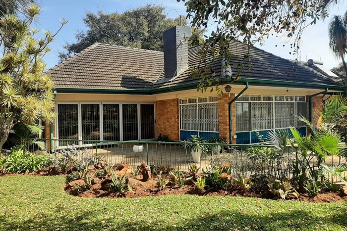 Kameeldoringpark House For Sale: Spacious living, secure parking, borehole garden, and outbuildings.