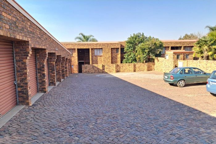 Zwartkop Apartment For Sale: Private garden, braai, pool, garage, near amenities.