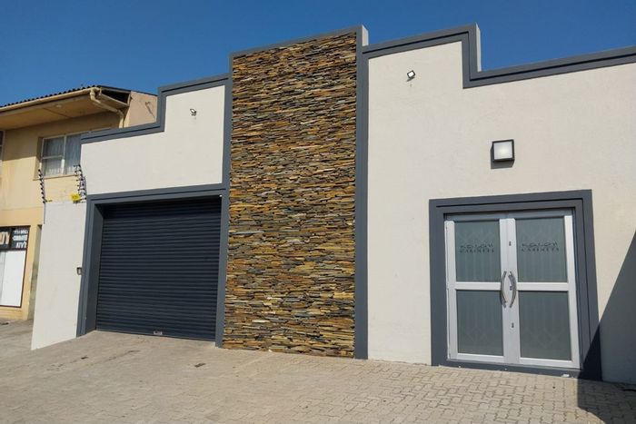 Industrial property for sale in Sidwell: offices, security system, inverter, high roll-up door.