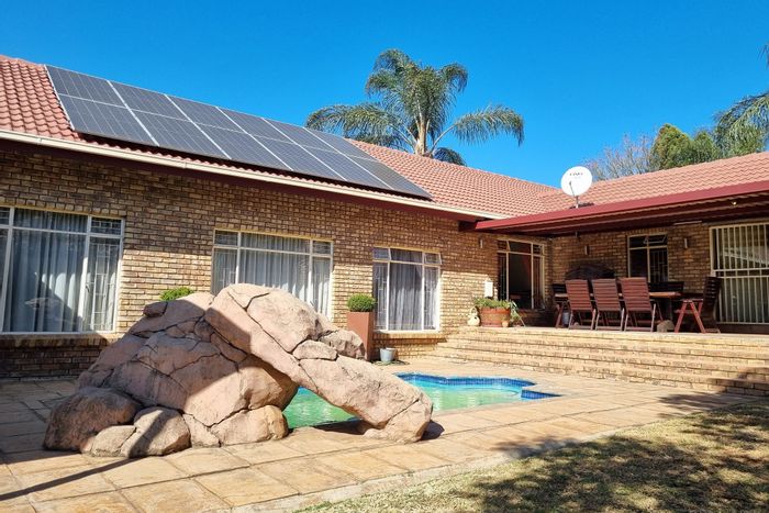 For Sale: House in Moreleta Park with pool, bar, solar power, and security.