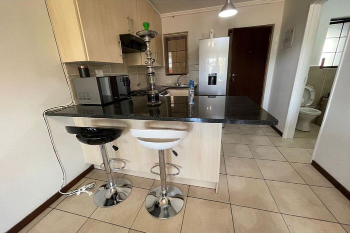 Rivonia Apartment To Rent: Furnished studio, secure complex, parking, family-friendly amenities.