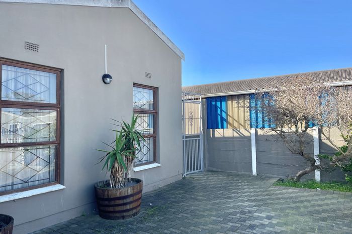 Affordable house for sale in Strandfontein with fitted kitchen and garage.