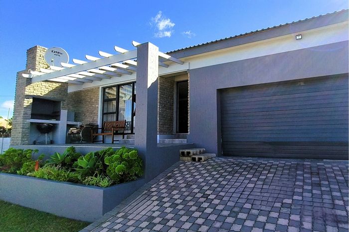 For Sale: House in Dana Bay with 3 bedrooms, open living area, and braai patio.