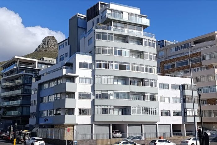 Sea Point Apartment For Sale: Sea views, enclosed balcony, steps from iconic pools.