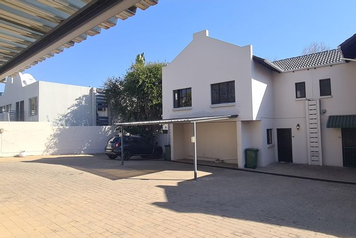 For Sale: Townhouse in Sandown with pool, garden, parking, and security features.