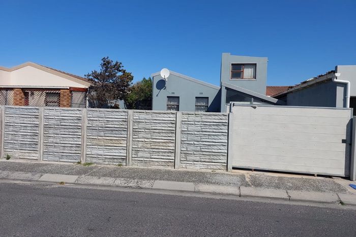 For Sale: 4-bedroom house in Strandfontein with ample parking and outdoor space.