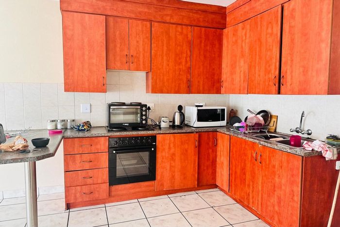 Spacious 3-bedroom apartment in Brits Central, for sale with ample parking.